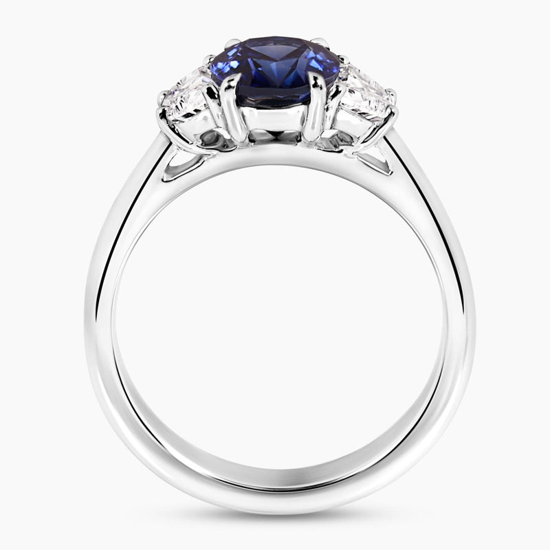 Platinum oval brilliant royal blue sapphire and diamond ring side view