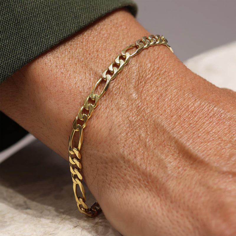 18ct yellow gold 21cm solid figaro link bracelet on wrist
