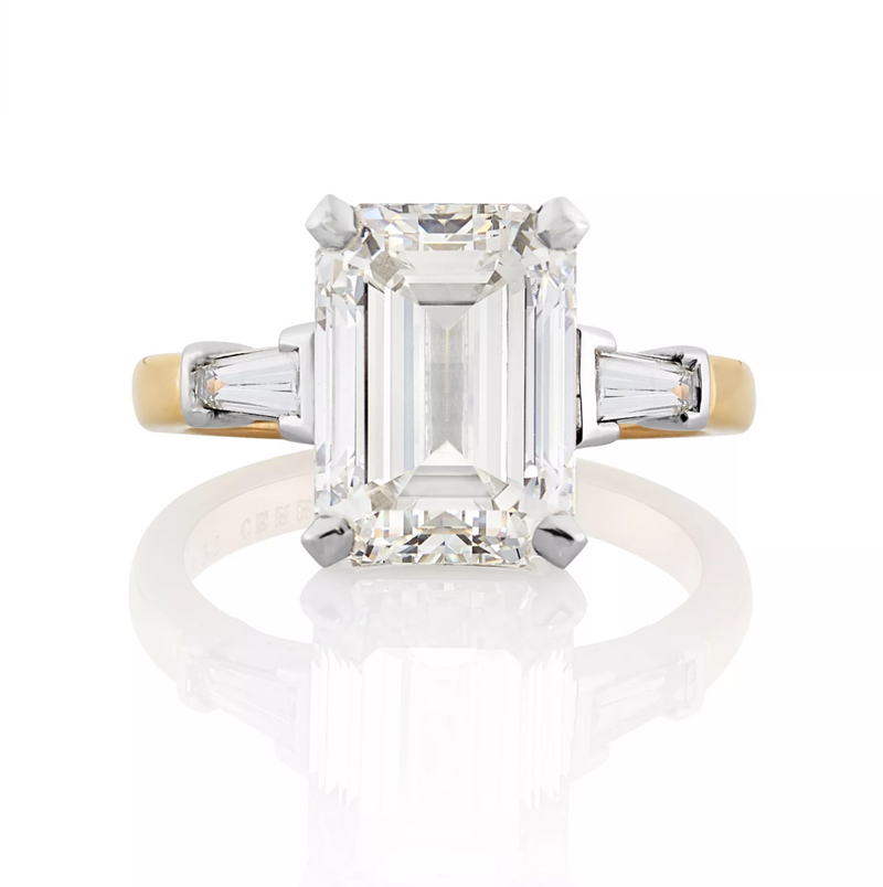 Platinum and rose gold emerald and tapered baguette trilogy ring