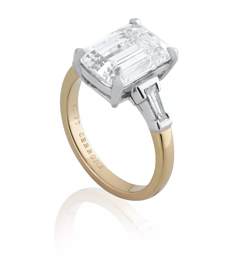 Platinum and rose gold emerald and tapered baguette trilogy ring side view