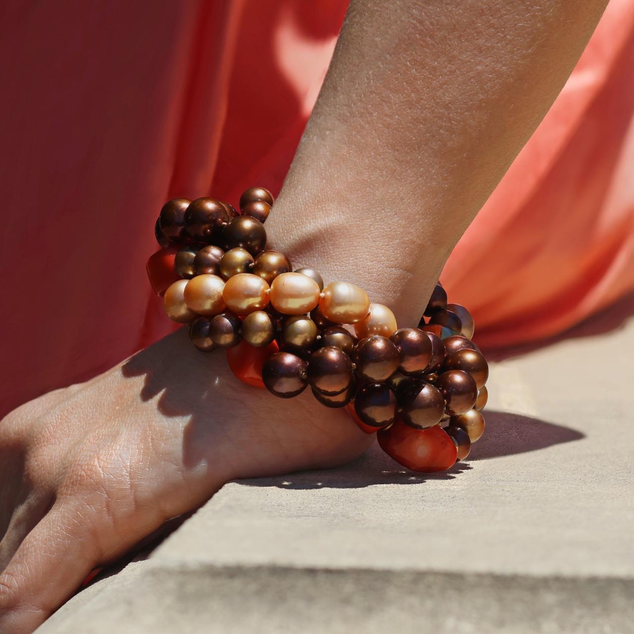 Bronze and brown Fresh water Pearls, Dyed Coral and gold plated rondells beaded bracelet on the wrist