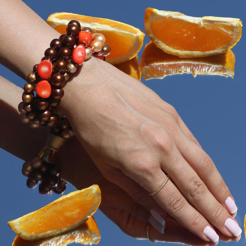Bronze and brown Fresh water Pearls, Dyed Coral and gold plated rondells beaded bracelet on the wrist