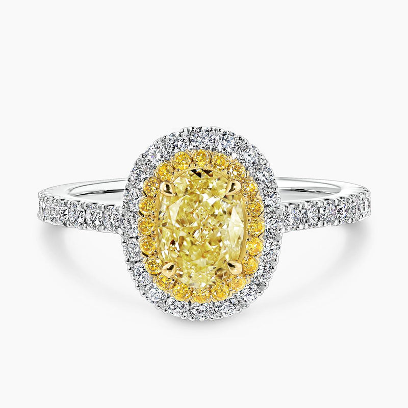 Platinum and 18ct yellow gold 1.04ct Fancy Intense Yellow oval and round diamond double halo ring