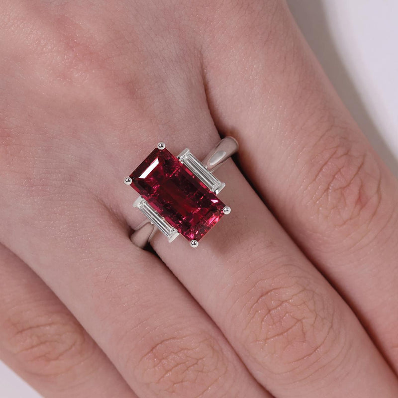 18ct white gold emerald cut rubelite and baguette diamonds ring on the finger