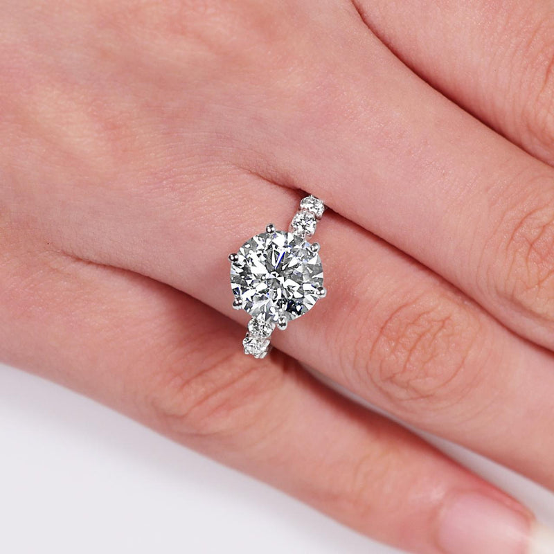 18ct white gold round brilliant cut lab grown diamond engagement ring on the finger
