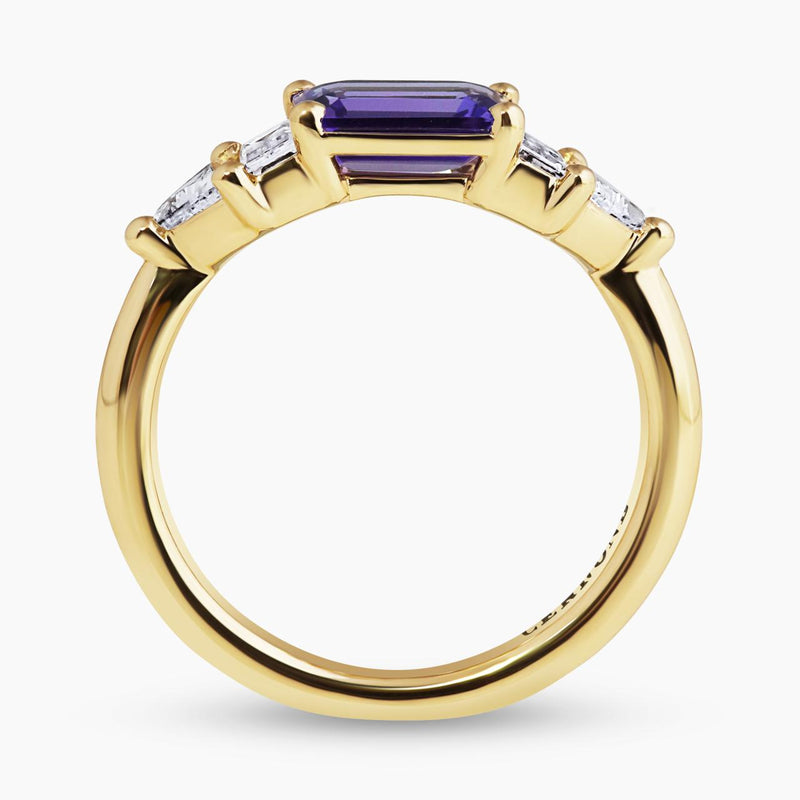 18ct yellow gold emerald cut tanzanite, baguette and trilliant cut diamonds ring side profile
