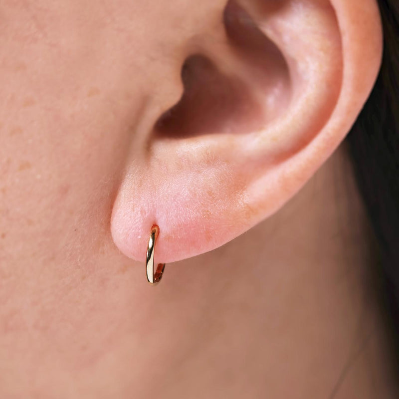 18ct yellow gold 8mm hinge sleeper hoop earrings on ear
