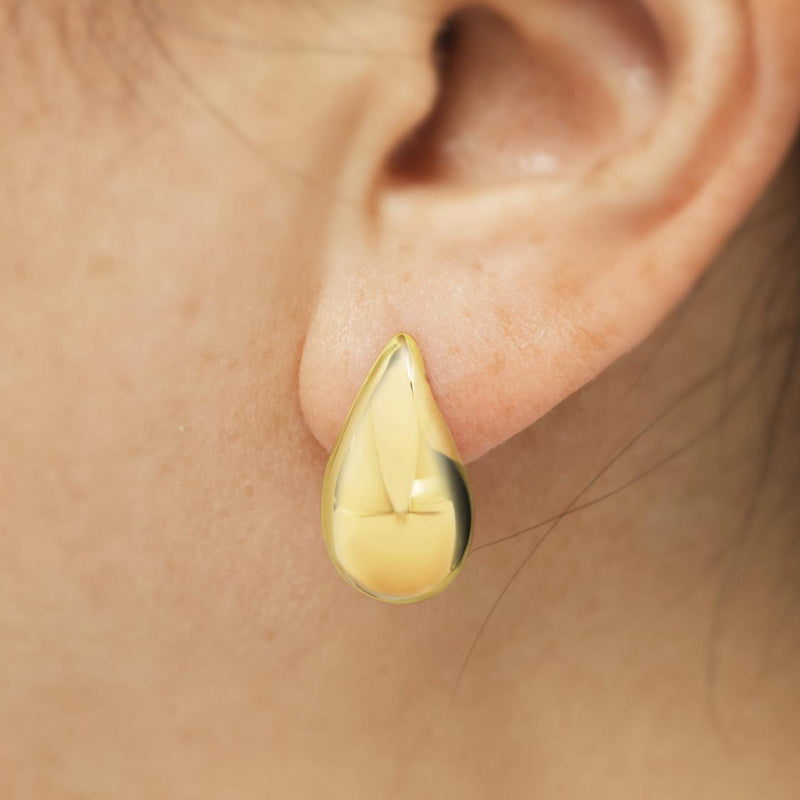 18ct yellow gold hollow tear drop stud earrings on ear