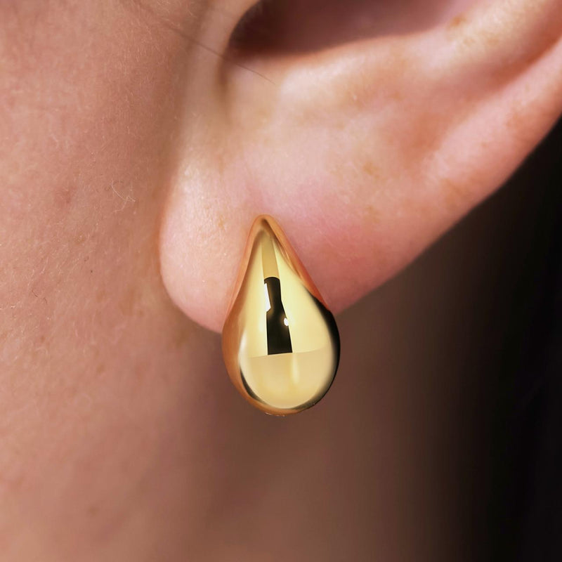 18ct yellow gold hollow tear drop stud earrings on ear