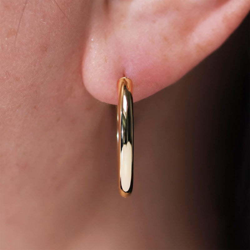 18ct yellow gold oval hinge hoop earrings 20 x 15mm on ear