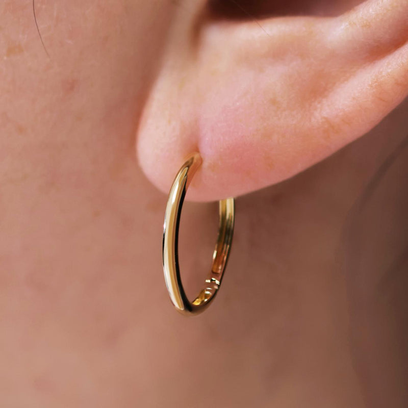 18ct yellow gold 16mm sleeper hinged hoop earrings on ear