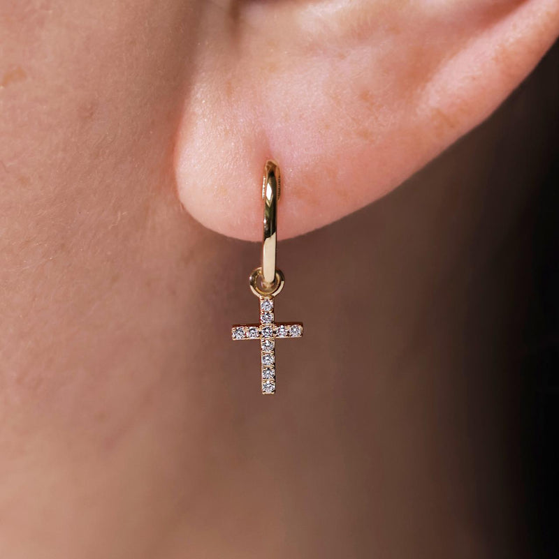 18ct yellow gold hoop earrings with diamond set crosses on ear