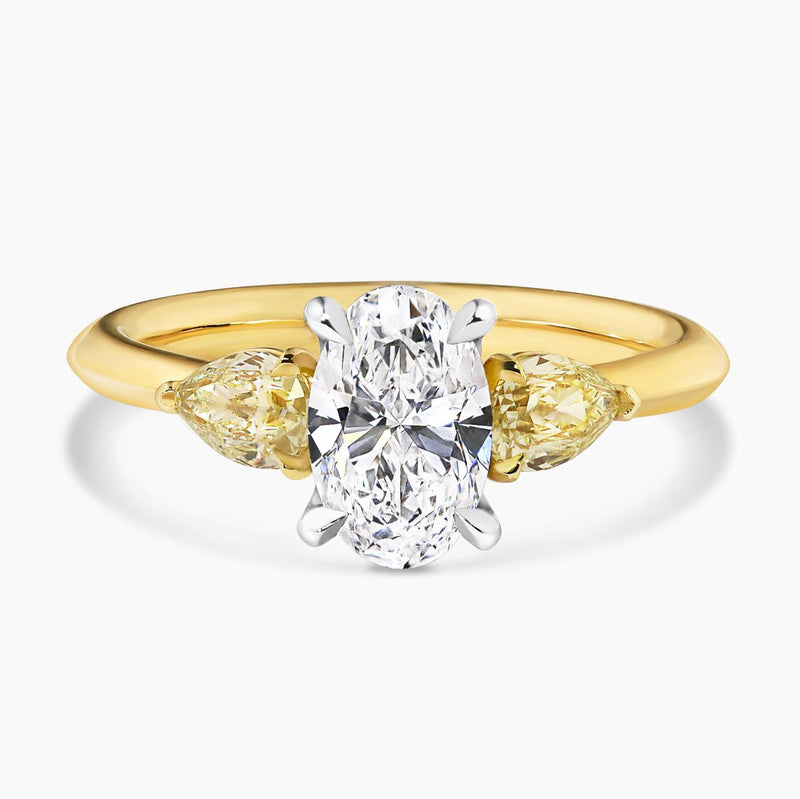18ct yellow and white gold 1.20ct oval shape and pear shaped diamonds engagement ring