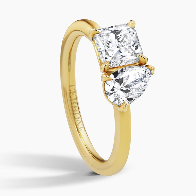 18ct yellow gold square radiant cut and pear shaped diamond engagement ring side profile