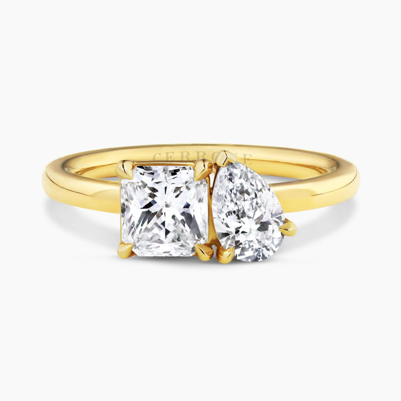 18ct yellow gold square radiant cut and pear shaped diamond engagement ring