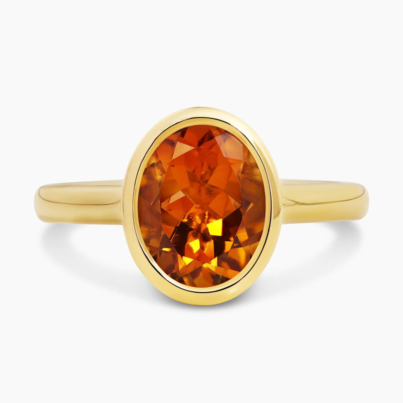 18ct yellow gold oval citrine ring in a bezel setting