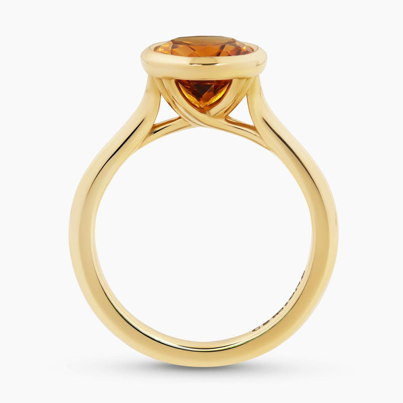 18ct yellow gold oval citrine ring in a bezel setting side profile