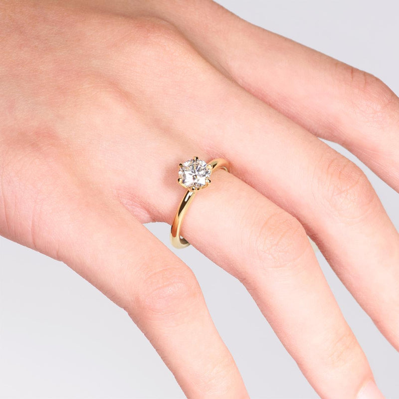 FLORENCE 18ct yellow gold 1.00ct round brilliant cut diamond six claw solitaire engagement ring on the finger
