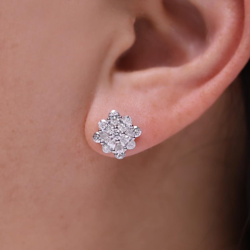 18ct white gold pear oval and round cut diamonds cluster stud earrings on ear