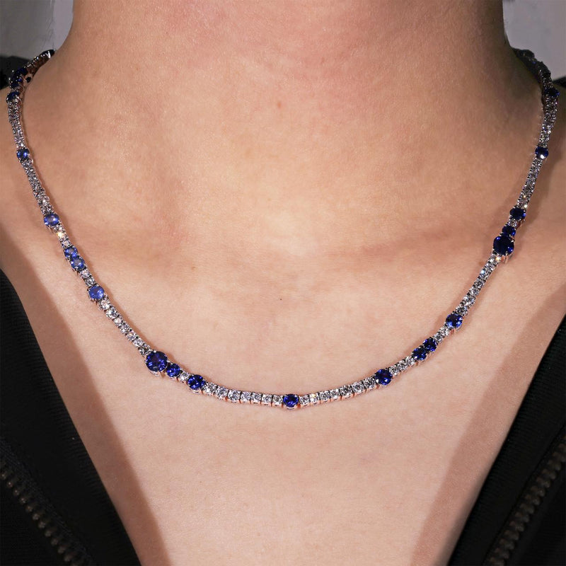 18ct white gold round blue sapphire and diamond tennis necklace on the neck