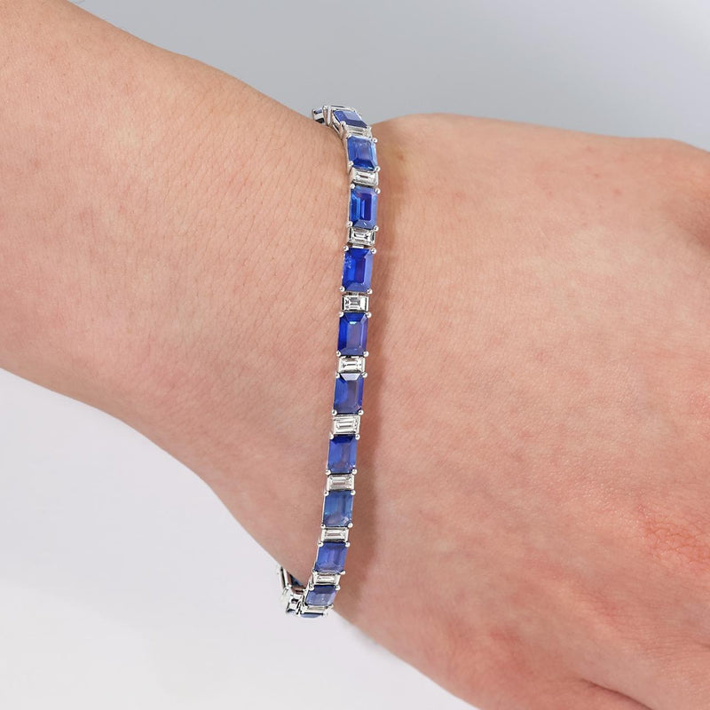 18ct white gold Madagascan emerald cut blue sapphire and emerald cut diamond bracelet on wrist