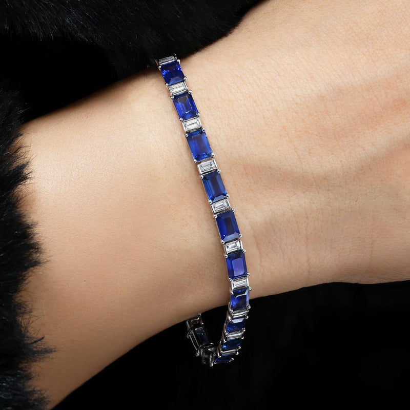 18ct white gold Madagascan emerald cut blue sapphire and emerald cut diamond bracelet on the wrist