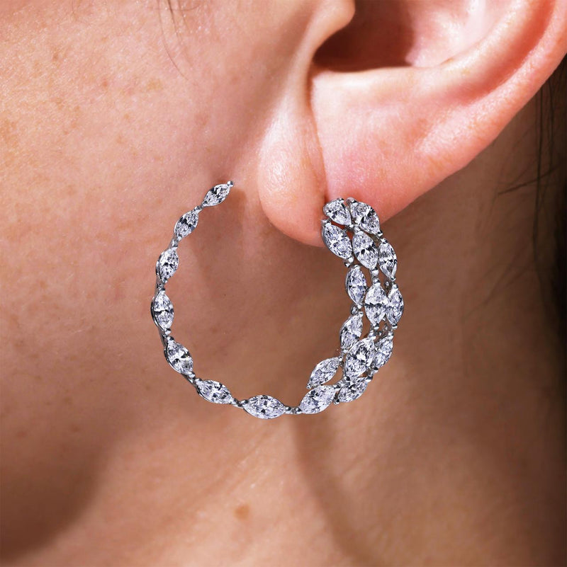 18ct white gold pear and marquise shaped diamond hoop earrings on ear