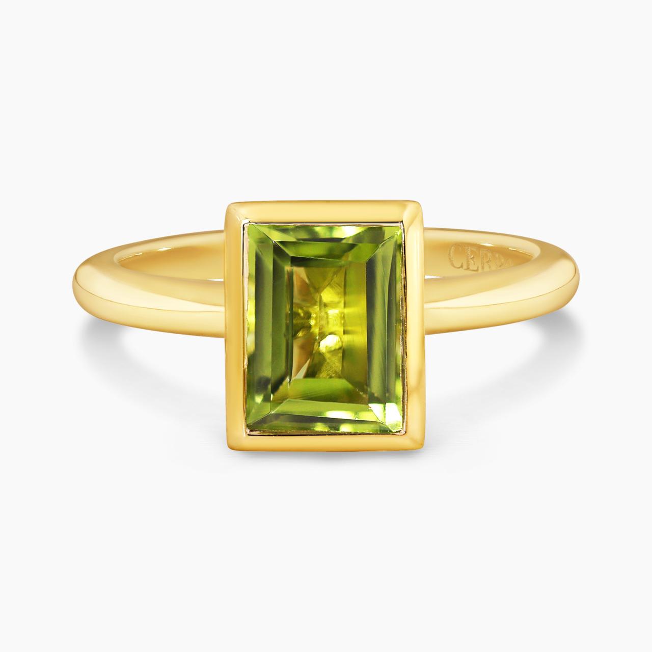 18ct yellow gold 1.90ct baguette peridot ring in a bezel setting