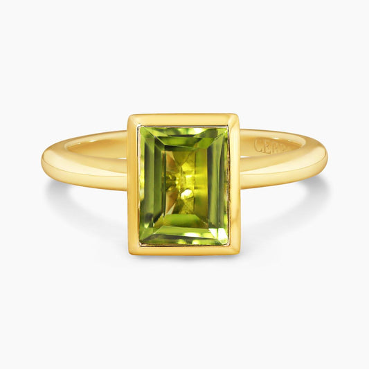 18ct yellow gold 1.90ct baguette peridot ring in a bezel setting
