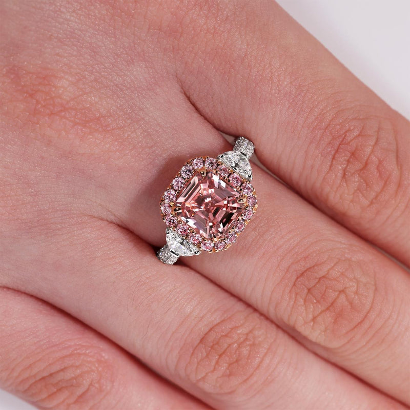 Platinum and 18ct rose gold octagonal step cut unheated Sri Lankan natural orange-pink Padparadscha sapphire and Argyle Pink diamonds ring side profile on the finger
