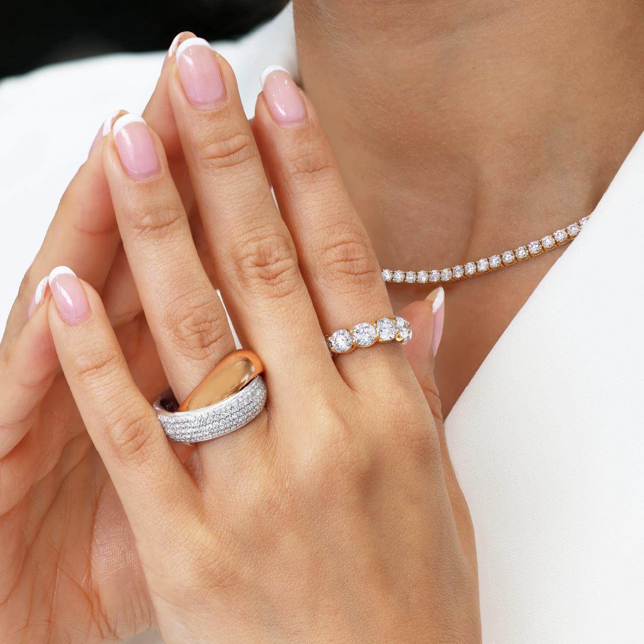 18ct white and rose gold diamond twist ring on the finger