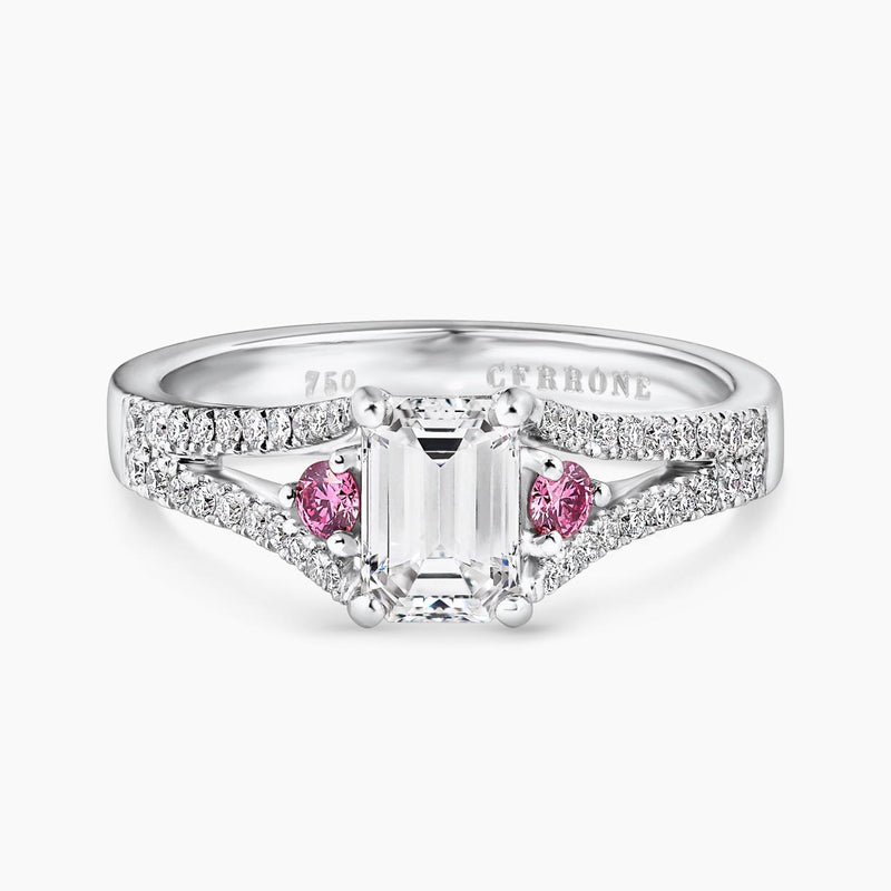 18ct white gold emerald cut diamond ring featuring round pink diamonds with split band
