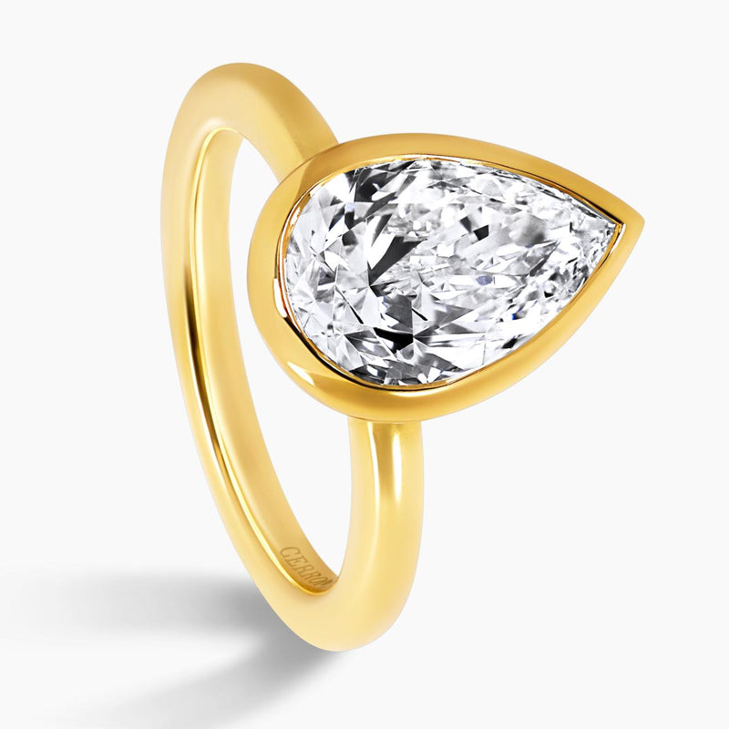 18ct yellow gold pear shaped LAB Grown Diamond bezel set solitaire ring side profile