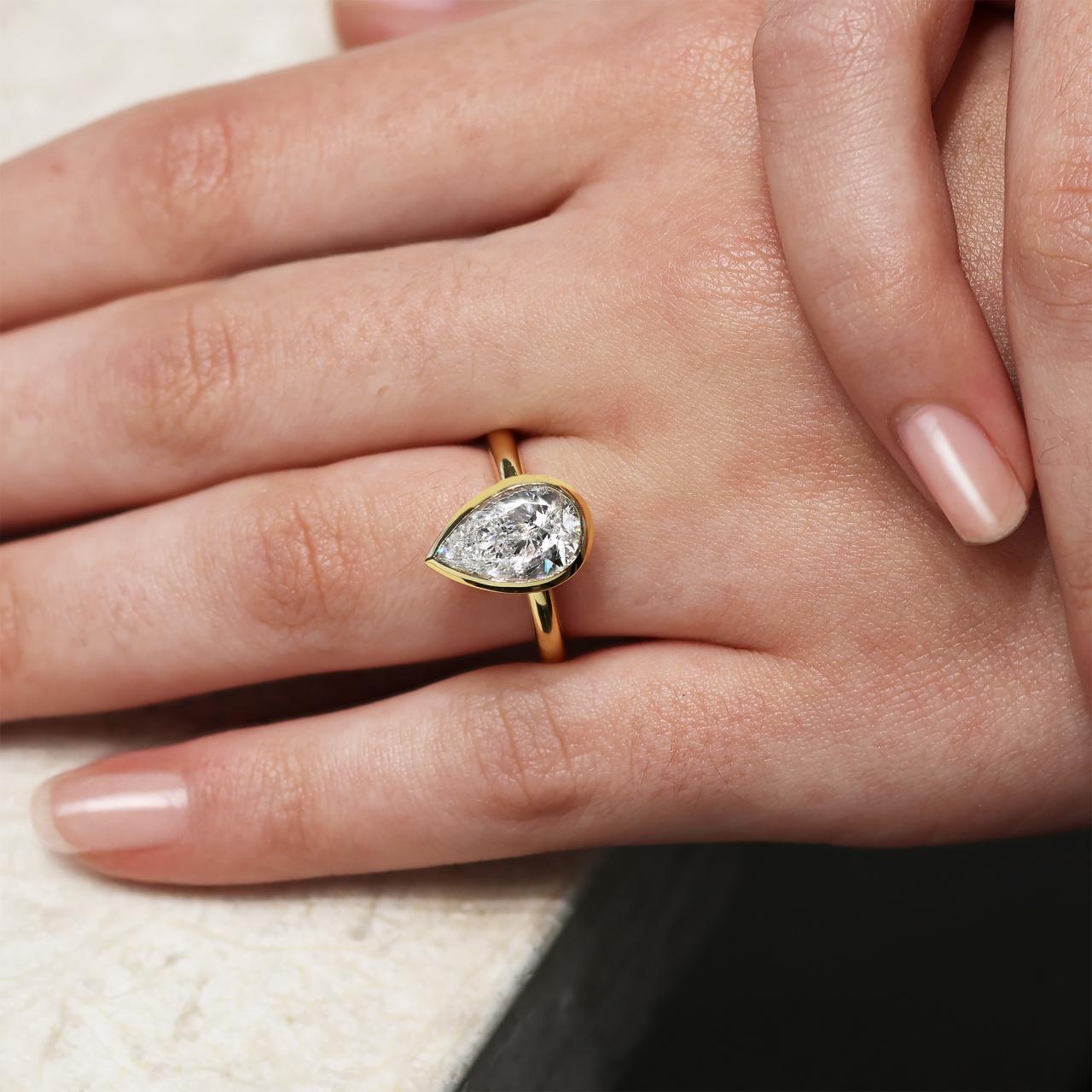 18ct yellow gold 3.01ct F VS1 pear shaped LAB Grown Diamond bezel set solitaire ring