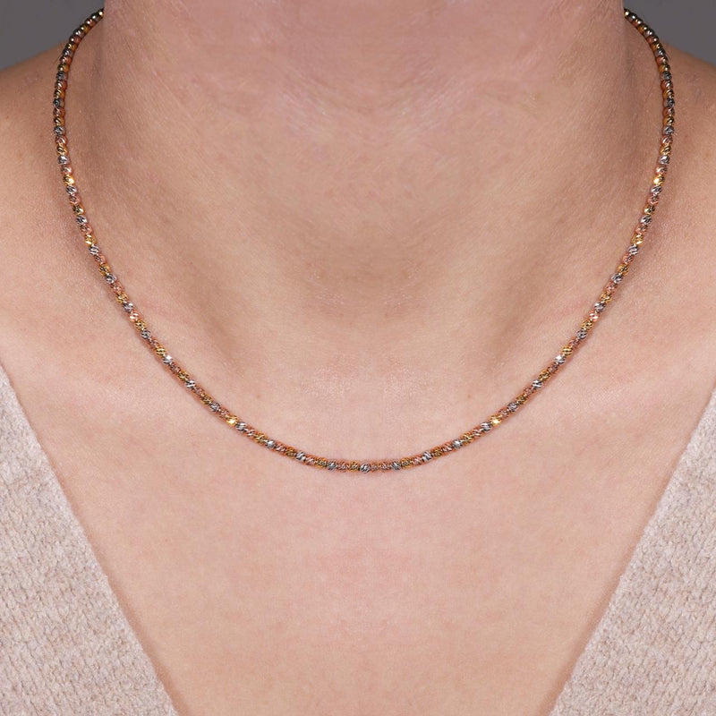 18ct white, yellow & rose gold ball necklace on neck