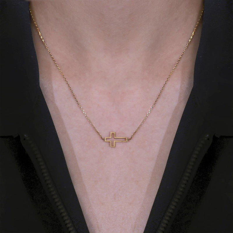 18ct yellow gold cross on chain necklace on neck