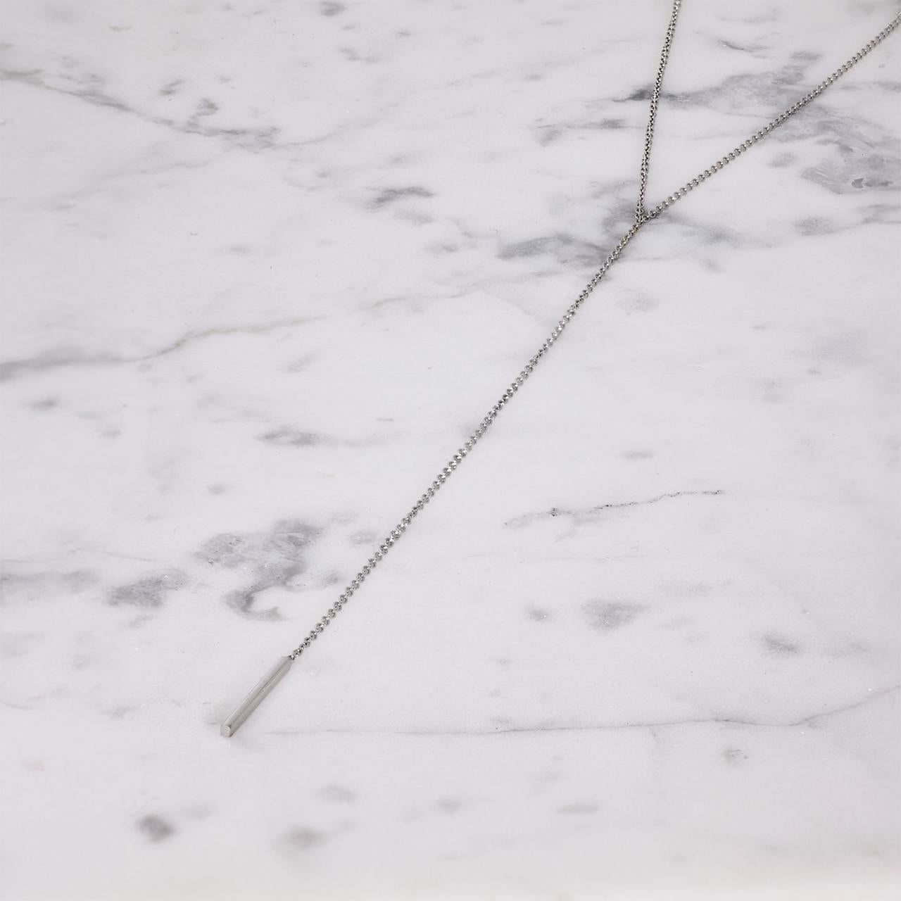 18ct white gold necklace features a drop with a solid bar