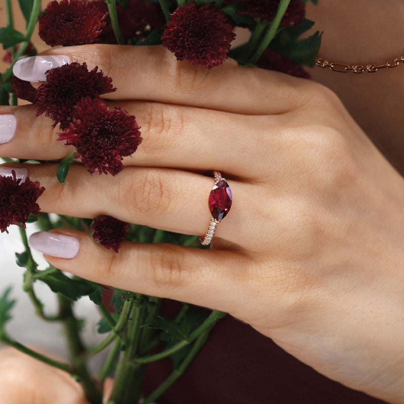 18ct rose gold marquise Rubellite tourmaline and diamond ring on the finger