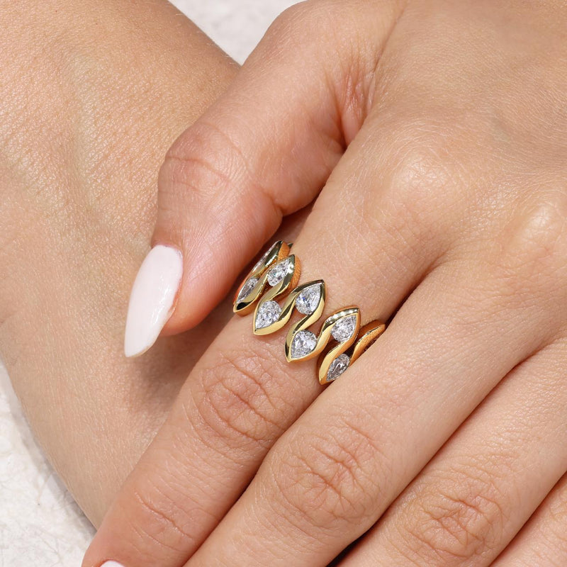 18ct yellow gold pear shape diamonds ring on the finger