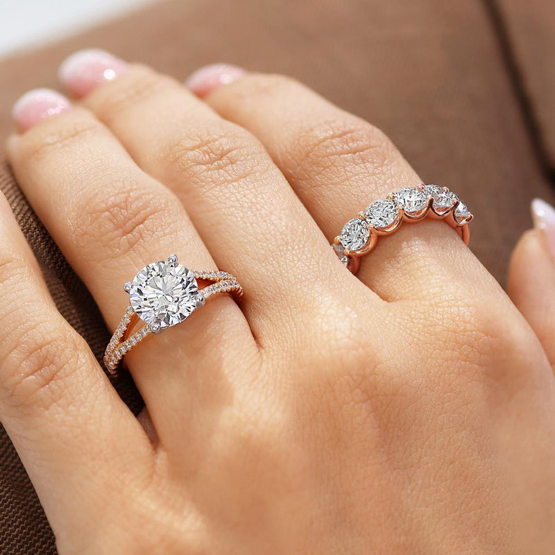 18ct rose gold seven round brilliant cut diamond ring on the finger