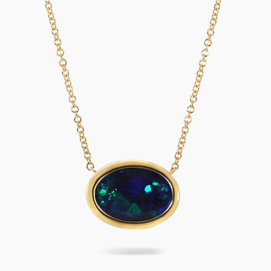18ct yellow gold 2.60ct oval cut solid black Lightning Ridge Opal bezel set  on an 18ct yellow gold 45cm chain