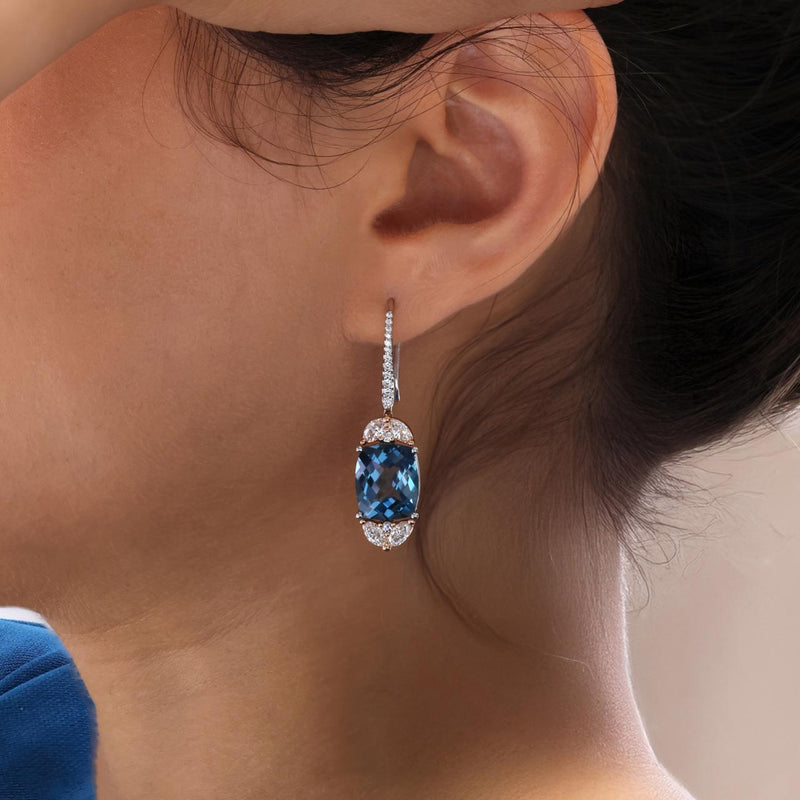 18ct rose and white gold 2=12.60ct cushion London blue topaz and diamond hook earrings on the ear