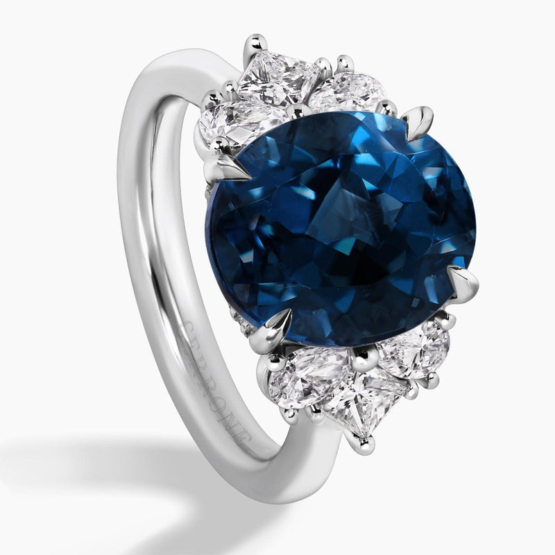18ct white gold 6.09ct oval shape London blue topaz and diamond ring with pear, princess and round brilliant cut diamonds side view