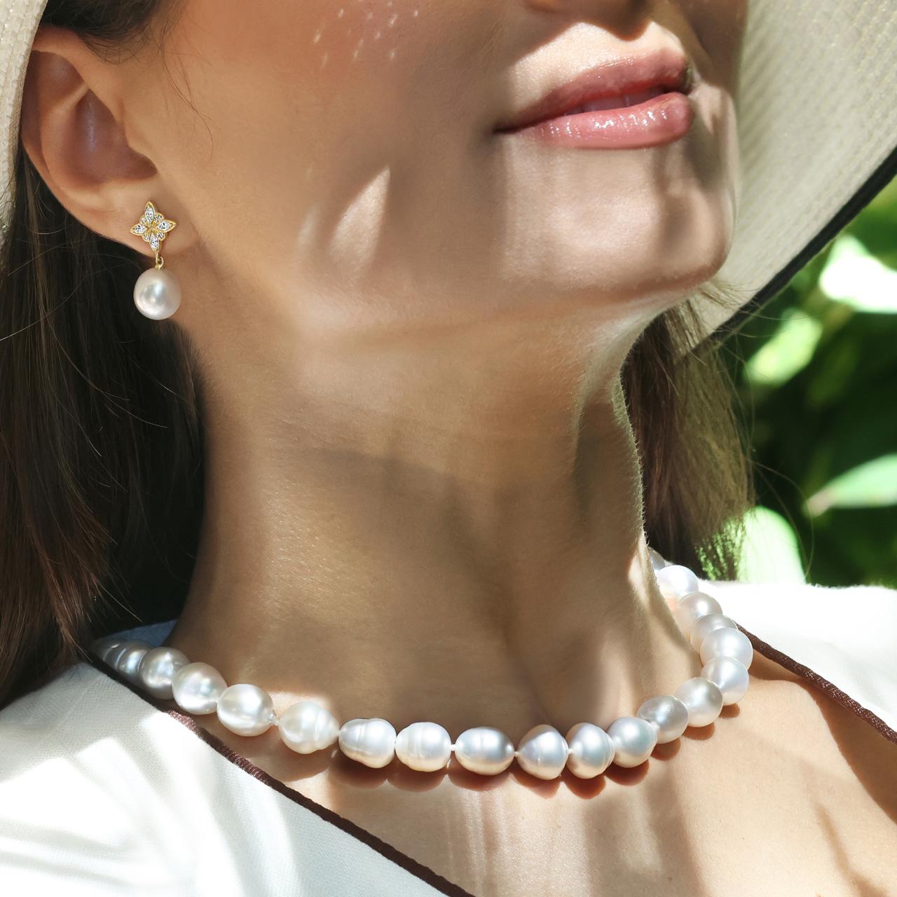 South Sea pearl 44cm single strand necklace features 10-13mm pearls and a 9ct yellow gold clasp displayed on the neck