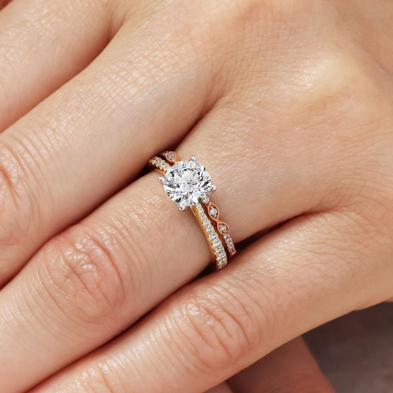 18ct yellow and white gold round brilliant cut diamond ring with diamonds on the band on finger