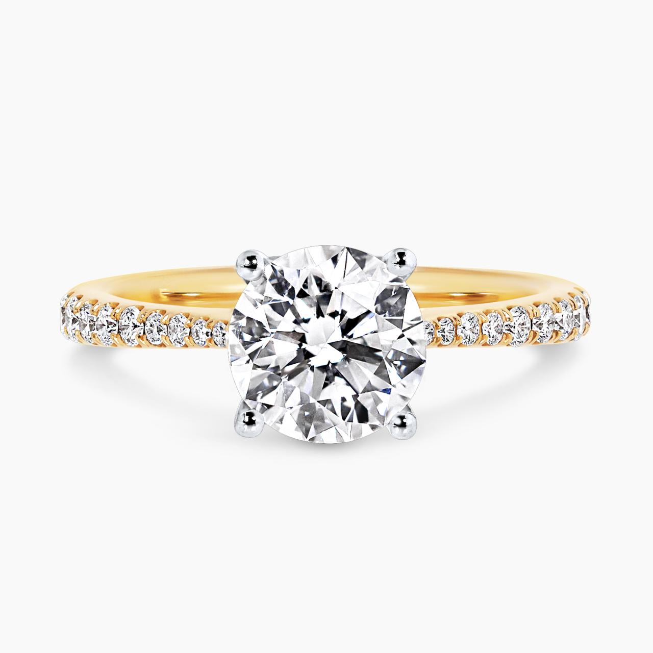 18ct yellow and white gold 1.50ct round brilliant cut diamond ring with diamonds on the band