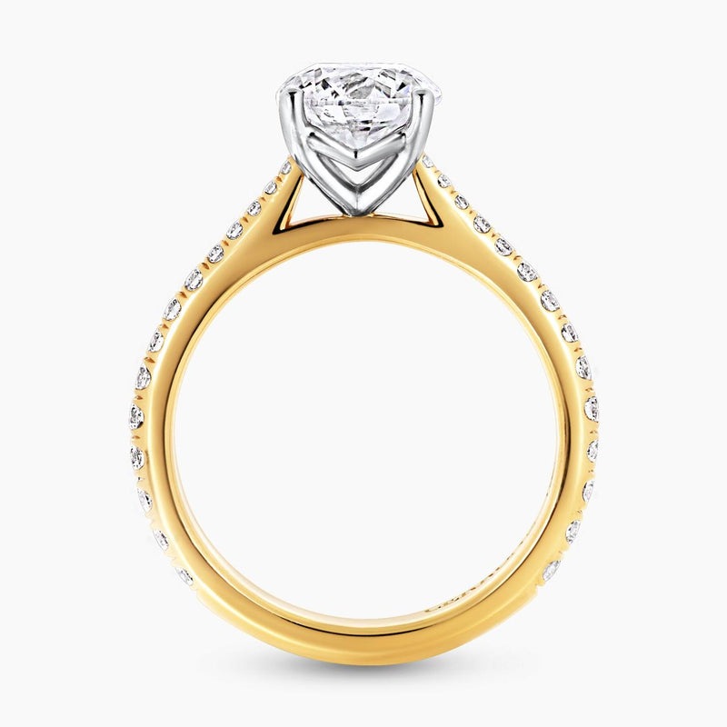 18ct yellow and white gold round brilliant cut diamond ring with diamonds on the band