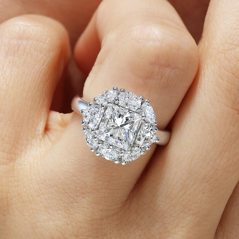 18ct white gold 2.00ct princess, oval and heart cut diamond halo ring on finger