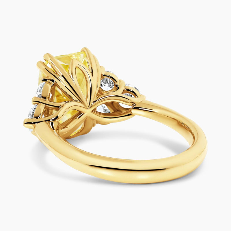 18ct yellow gold fancy vivid yellow radiant cut lab grown diamond pear and round brilliant cut diamond engagement ring