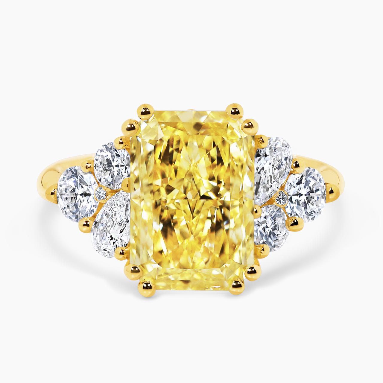 18ct yellow gold 4.82ct fancy vivid yellow radiant cut lab grown diamond 8=0.91ct pear and round brilliant cut diamond ring